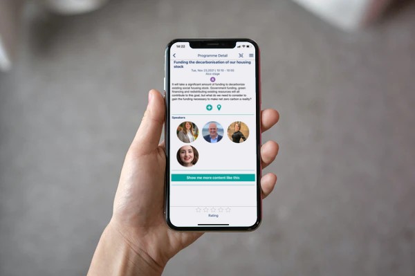 Woman holding iphone showing event information in VenuIQ